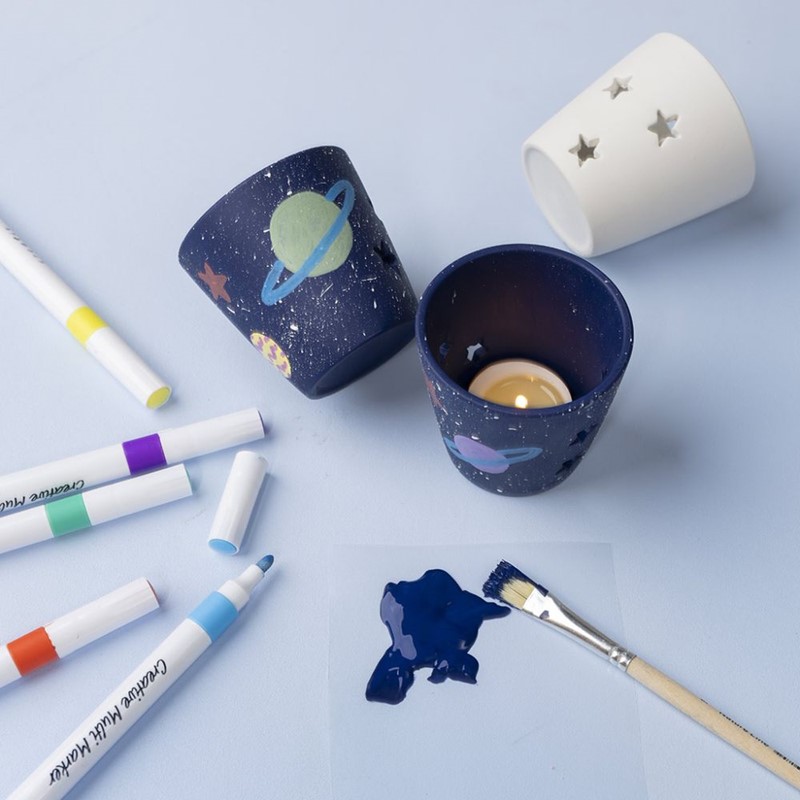Theelichthouders met sterren en planeten