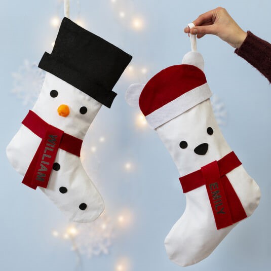 Kerstsok gedecoreerd met sneeuwpop en ijsbeer